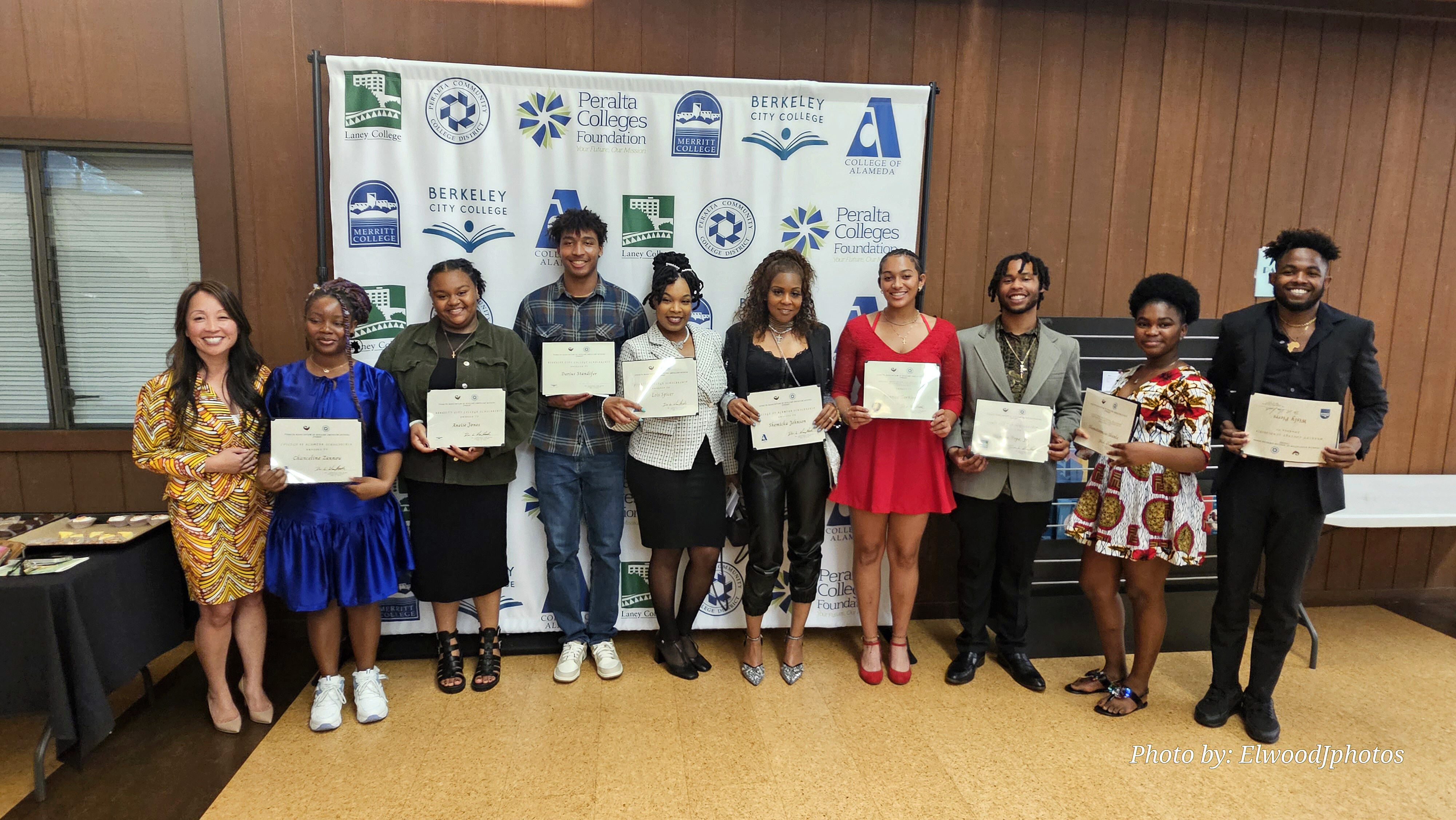 Chancellor Dr. Tammeil Gilkerson poses with the nine students who received scholarship awards from the Peralta Association of African American Affairs