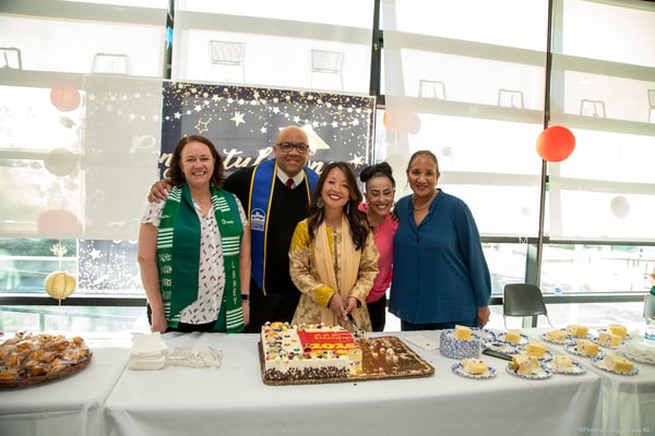 Chancellor and Presidents serve cake 758A5739