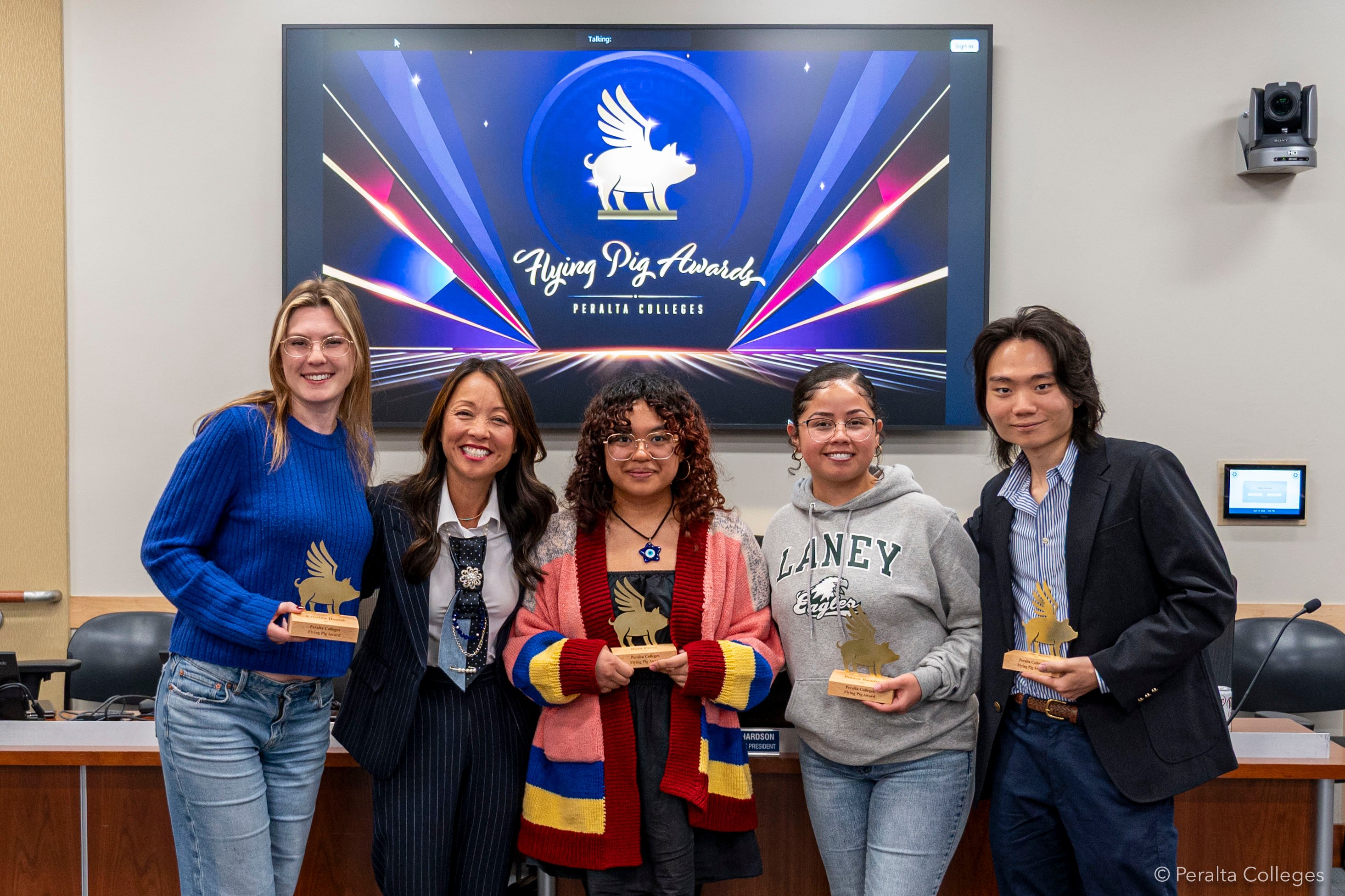 Five people standing and smiling, left to right: Kristina Hoessl, Tammeil Gilkerson, Rosa Perez, Bianca Ramirez, and Rey Saitoh