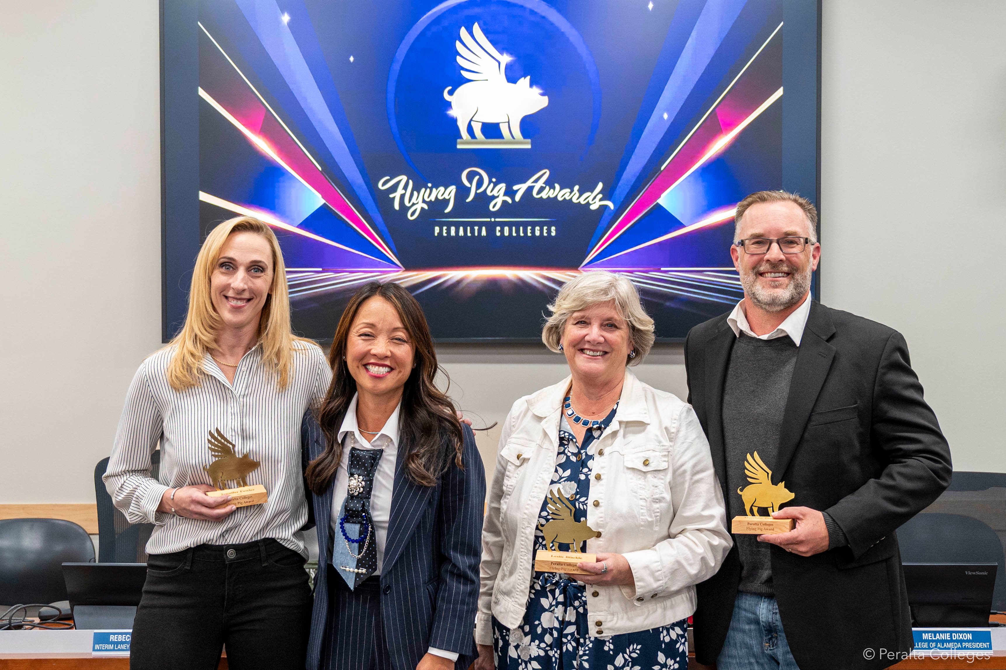 Four people standing and smiling, left to right: Jennifer Fowler, Tammeil Gilkerson, Leslie Blackie, and Matthew Freeman