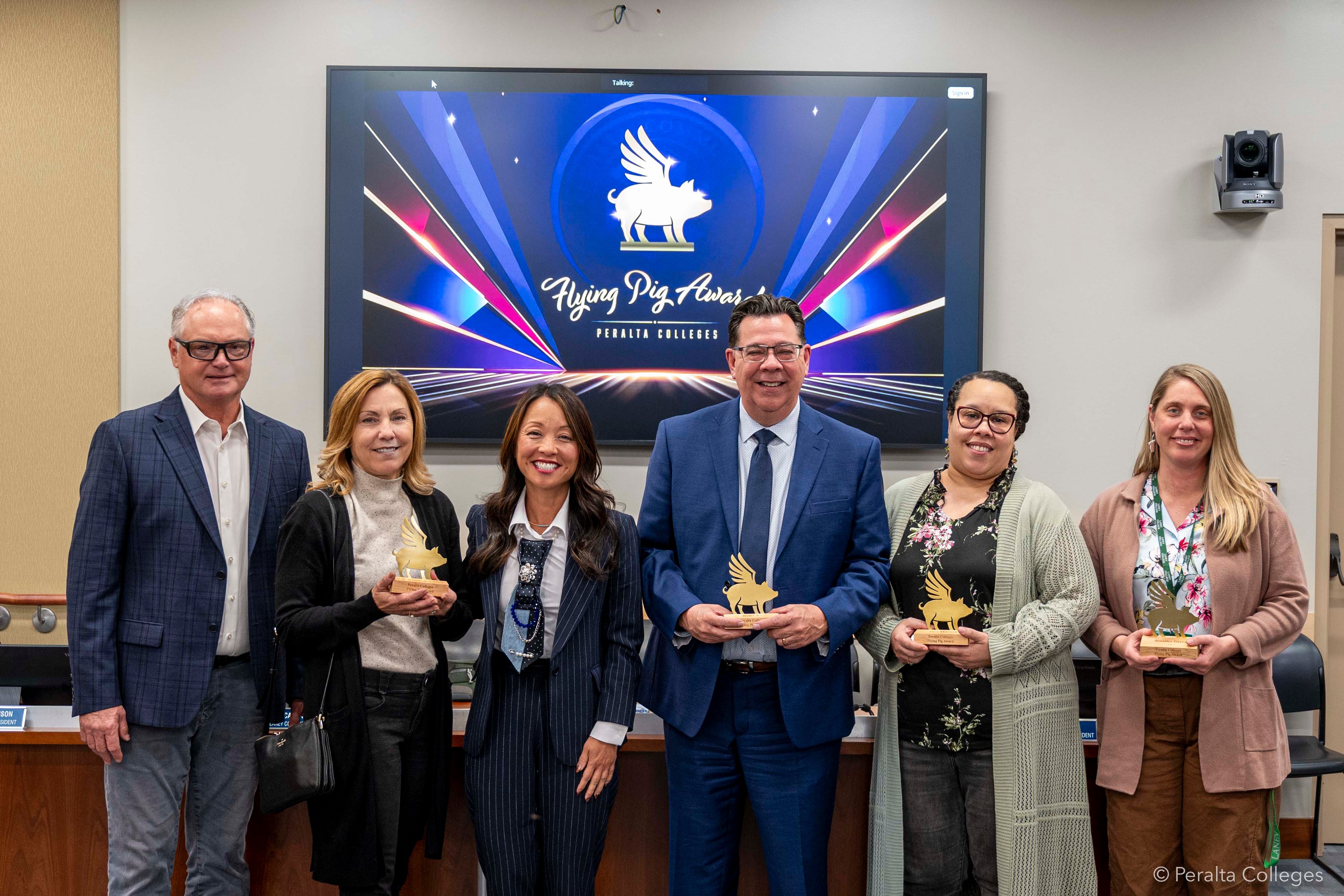 Six people standing and smiling, left to right: Bob and Shannon Alten, Tammeil Gilkerson, Ken Lira, Tara Marrero, and Jennifer Gerry