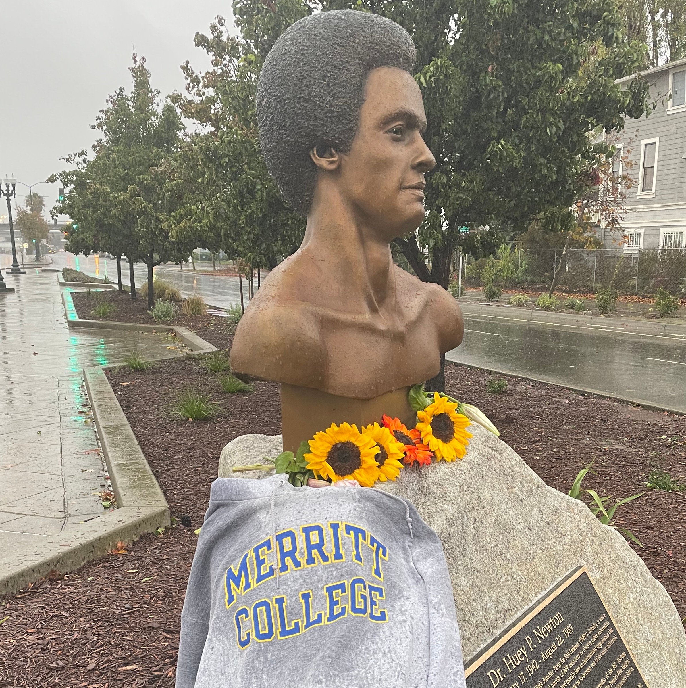 Huey Newton statue with Merritt College sweatshirt