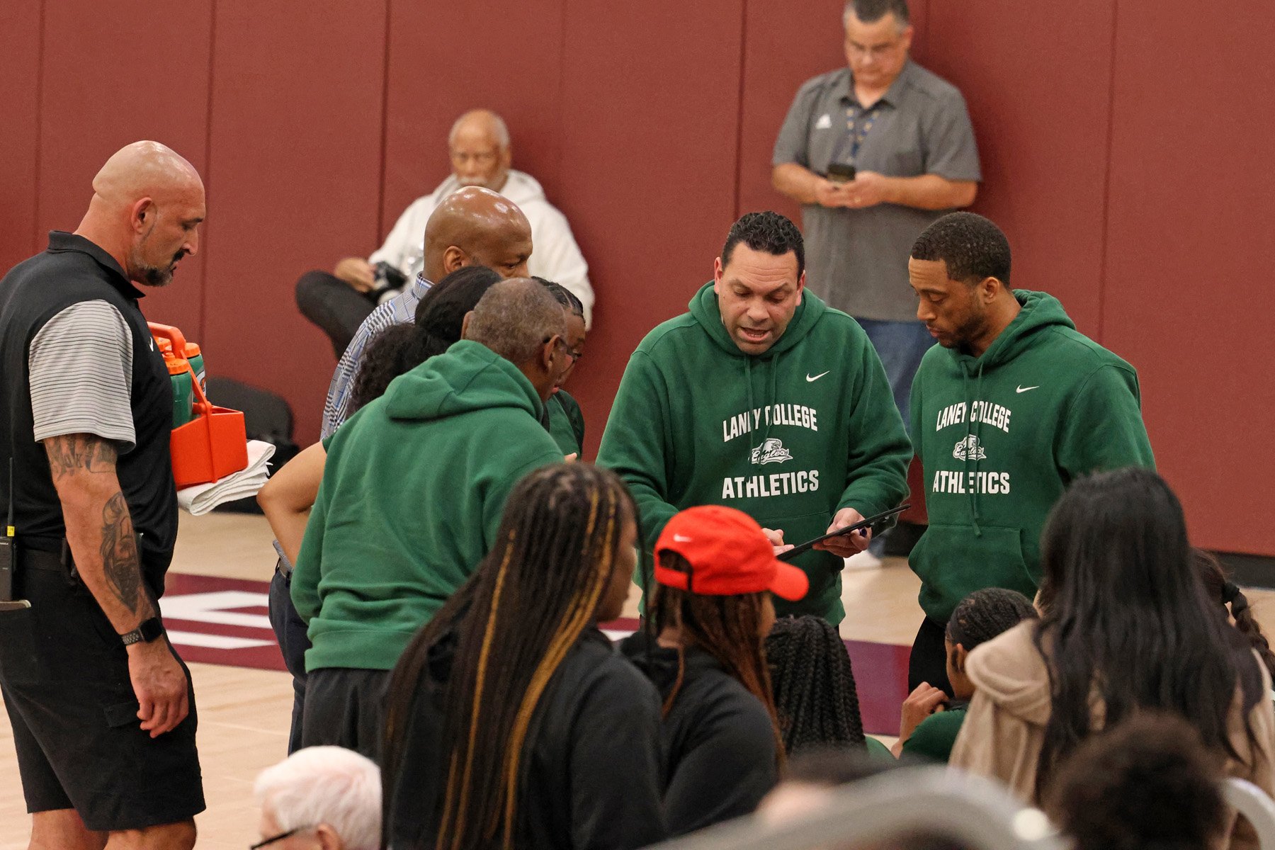 Laney College Women's Basketball coaches at the state quarterfinals March 2024