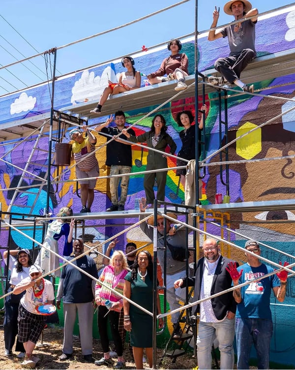 Laney College Students with Vibrant Mural