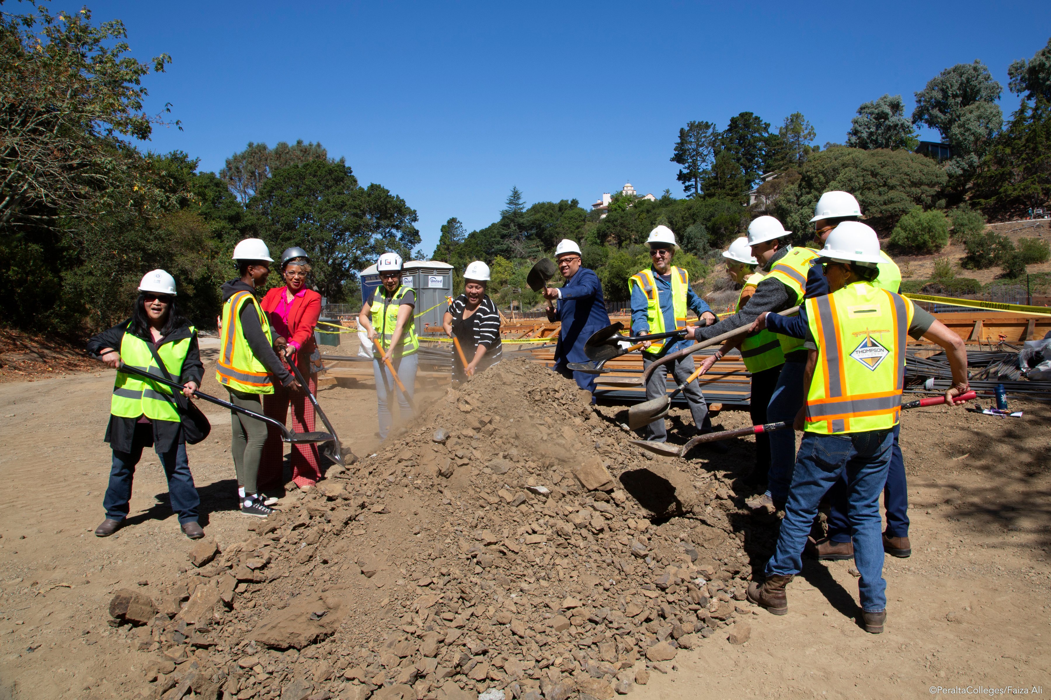 community leaders break ground with shovels