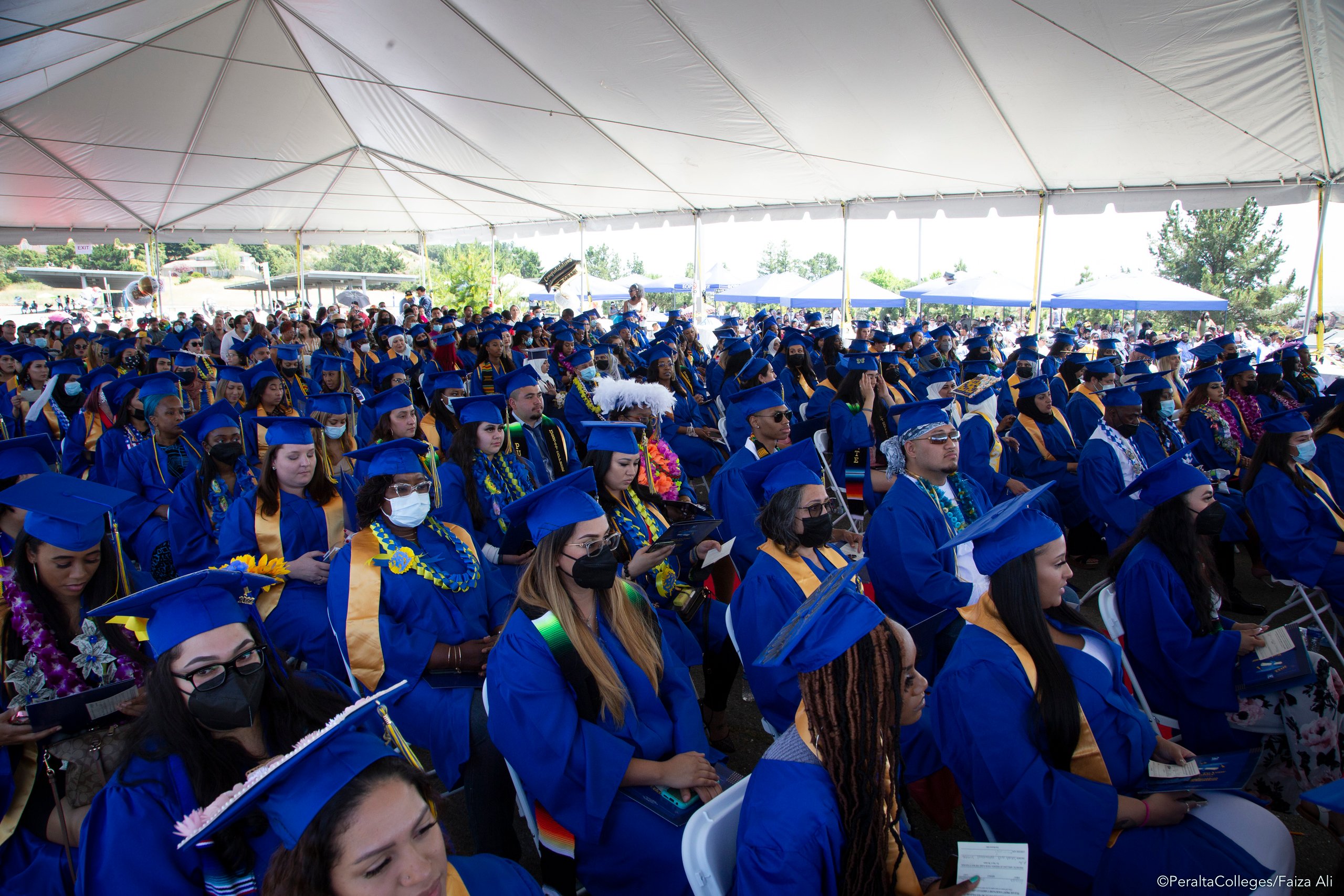 Merritt graduates under the tent_F0A5009-X5