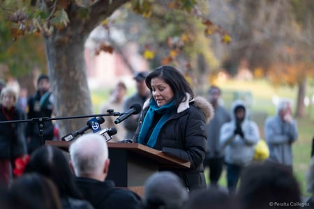 Tish Gallegos, a member of the Beam family, addresses the crowd